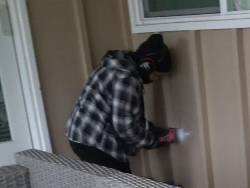 Professional electrician installing an exterior outlet in Yukon